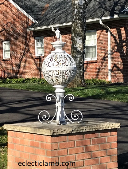 Finial on stone pillar